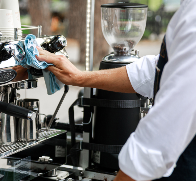 coffee machine maintenance, wiping with a cloth